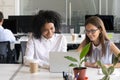 Colleagues working at same task on laptop together Royalty Free Stock Photo