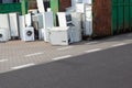 Old electrical appliances, washing machines in container. Recycling center