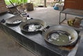 Collected coconut tree sap heated in large woks to evaporate the moisture content of the sap Royalty Free Stock Photo