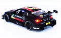 Collectible car toy Mercedes-Benz C63 AMG on luminous background. Back view
