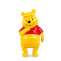 Collectible toy bear Winnie the Pooh on a white background