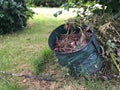 Collecting garbage green waste in soft containers bags in the garden