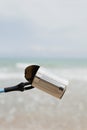 Collecting garbage in a lonely beach