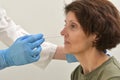 Collecting a nasopharyngeal nose and throat swab Royalty Free Stock Photo