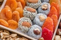 Collecting nuts and dried berries. Assorted dried fruits in a wooden box. Close-up Royalty Free Stock Photo