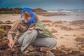 Collecting shells on the coast Royalty Free Stock Photo