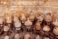 Collection of ancient clay jars, pots and bottles. Exhibition in an archeology museum. Selective focus