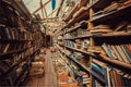 Collection of antique books inside old bookstore with corridors and tall bookshelves