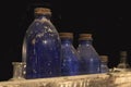 Antique Bottles in Abandoned Store Window Royalty Free Stock Photo