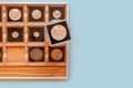 Collection of antique coins in plastic cases in wooden coin album. Numismatics metal coins in transparent cases