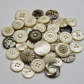 A collection of assorted buttons featuring various designs and textures. The buttons Royalty Free Stock Photo