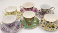Collection of assorted ceramic teacups arranged on a tabletop