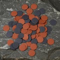 A collection of assorted circular abrasive sanding discs in gray and reddish-brown is Royalty Free Stock Photo