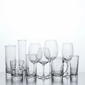 A collection of assorted glassware is displayed on a flat surface. The array includes Royalty Free Stock Photo