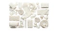Collection of assorted white paper products and rolls arranged artistically on a dark surface Royalty Free Stock Photo
