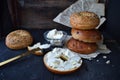 Assorted Bagels with cream cheese on rustic table with music sheets horizontal layout