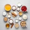 A collection of baking ingredients arranged on a light gray surface Royalty Free Stock Photo