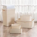 Collection of baskets and bins arranged on the floor.