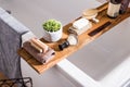 Collection of bathroom equipment towels, shaving brush, hairbrush, shampoos and soap on a wood Royalty Free Stock Photo