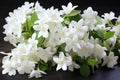 A collection of beautiful white flowers placed elegantly on a table, White jasmine flowers, fresh flowers natural, AI Generated Royalty Free Stock Photo