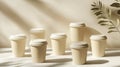 A collection of beige takeaway coffee cups arranged in a stylish mockup setting Royalty Free Stock Photo