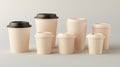 A collection of beige takeaway coffee cups arranged in a stylish mockup setting Royalty Free Stock Photo