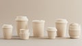 A collection of beige takeaway coffee cups arranged in a stylish mockup setting Royalty Free Stock Photo