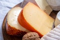 Collection of Belgian cheeses, soft yellow cow milk cheese with white mold from Bruges, bouquet des moines from Abbey of Val-Dieu Royalty Free Stock Photo