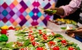 Collection of betel leaf banarasi paan and fire paan displayed for sale at a shop with selective focus and blurred