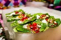 Collection of betel leaf banarasi paan and fire paan displayed for sale at a shop with selective focus and blurred