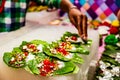 Collection of betel leaf banarasi paan and fire paan displayed for sale at a shop with selective focus and blurred