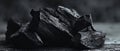 The collection of black charcoal pieces on a textured surface. AI generated image Royalty Free Stock Photo