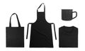 Collection of black objects isolated on white background. Black cotton bag, black folded t-shirt, kitchen apron, metal Royalty Free Stock Photo