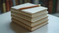 Collection of blank notebooks stacked on a table with a pencil resting on top Royalty Free Stock Photo