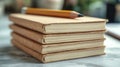 Collection of blank notebooks stacked on a table with a pencil resting on top Royalty Free Stock Photo