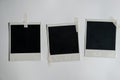 Collection of blank photo frames taped on white wall. Set of photos frame for your picture. Photo frame on a white Royalty Free Stock Photo