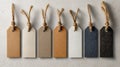 Collection of blank rectangular price tags with rustic twine arranged in a row on textured light surface, showcasing natural and Royalty Free Stock Photo