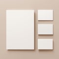 A Collection of Blank White Cards and Sheets Arranged Aesthetically on a Soft Beige Background Royalty Free Stock Photo