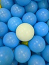 This is a collection of blue balls and there is one white ball on the playing field. then I perpetuate it Royalty Free Stock Photo