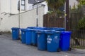 A collection of Blue bins containing re-cyclable waste