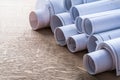 Collection of blueprint rolls on wooden oaken Royalty Free Stock Photo
