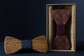 Collection of bow ties made of handmade wood, on a black background Royalty Free Stock Photo