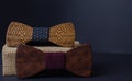 Collection of bow ties made of handmade wood, on a black background Royalty Free Stock Photo