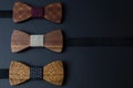 Collection of bow ties made of handmade wood, on a black background.jpg Royalty Free Stock Photo