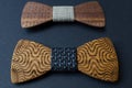 Collection of bow ties made of handmade wood, on a black background.jpg Royalty Free Stock Photo