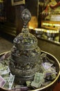 A collection bowl with financial offerings in Palcho Monastery in Tibet Royalty Free Stock Photo