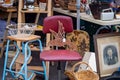 Collection of bric a brac on market stall including rusty iron bird at Frome Sunday Market, Somerset, UK