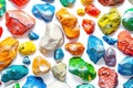 A collection of brightly colored rocks arranged neatly on a white surface, great for decorative or educational purposes Royalty Free Stock Photo