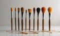 A collection of brushes are lined up in a row, with the first brush on the left and the last brush on the right. Royalty Free Stock Photo