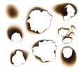 Collection of burnt holes in a piece of paper